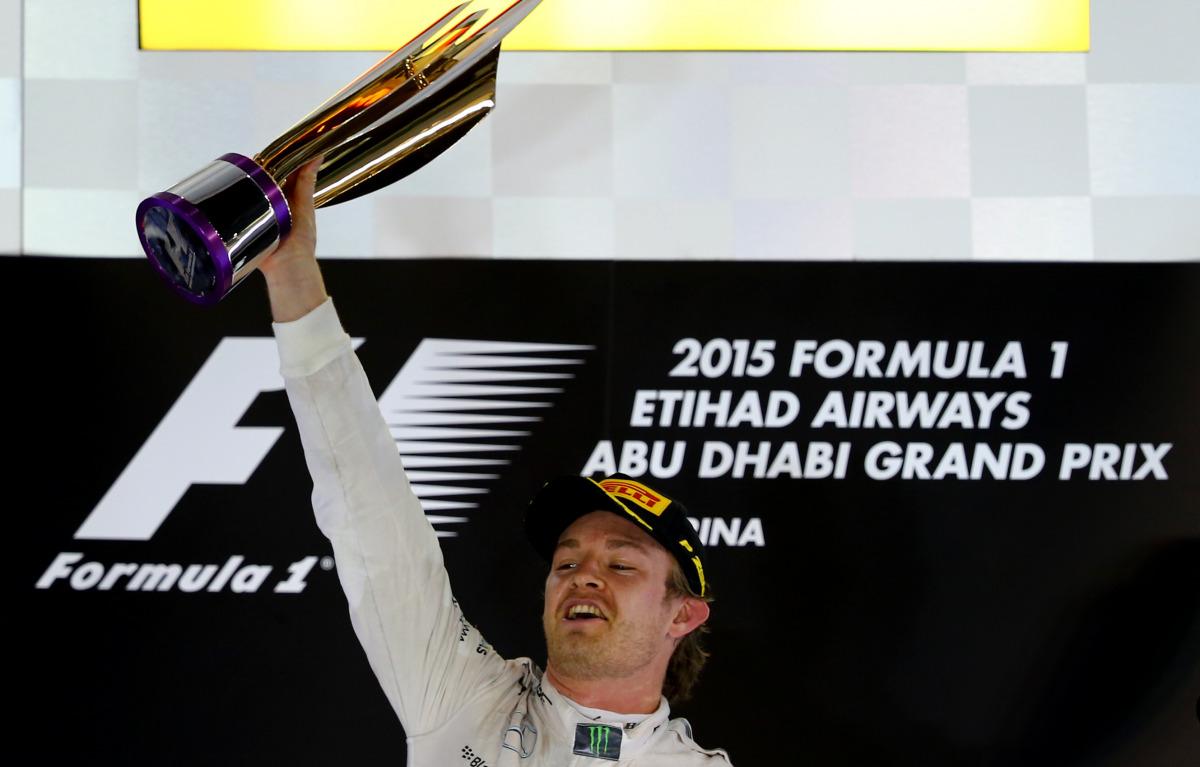 Nico Rosberg celebrating on the podium at the Yas Marina circuit in Abu Dhabi after the Abu Dhabi Formula One Grand Prix. (AFP / MARWAN NAAMANI)