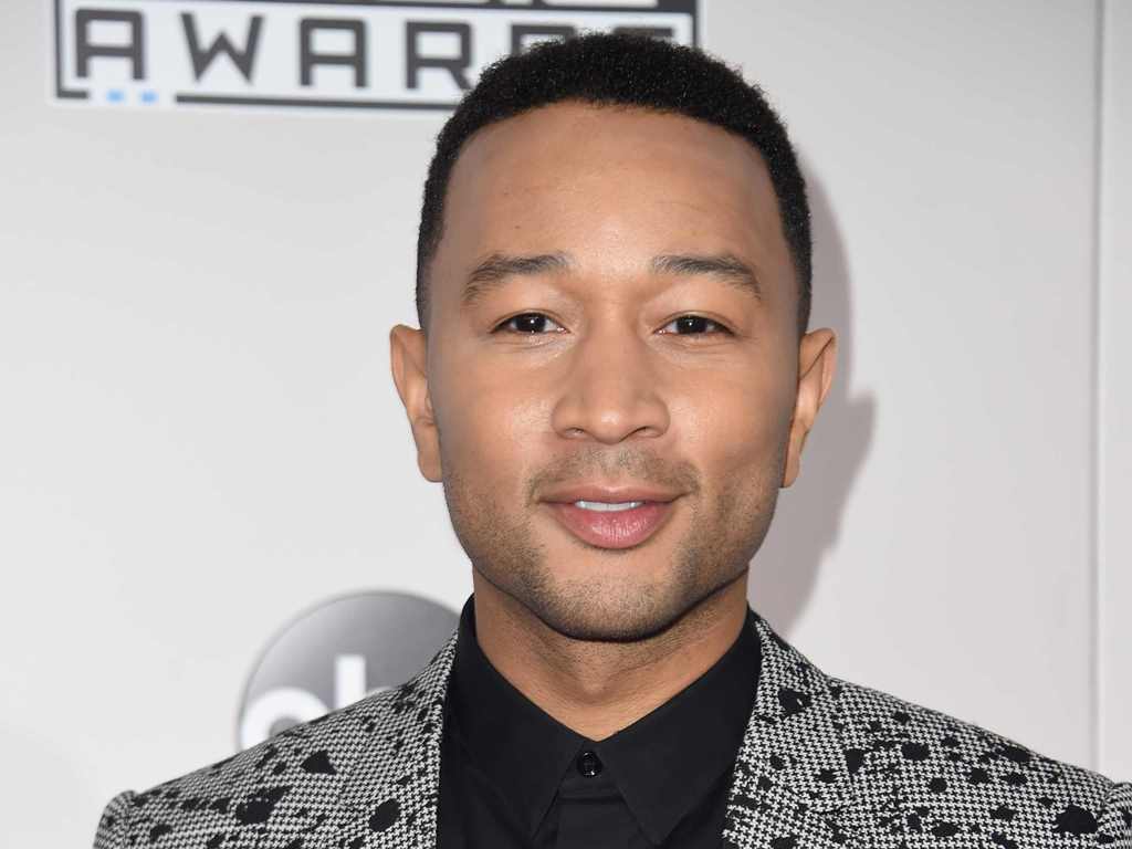 (FILES) This file photo taken on November 20, 2016 shows Recording artist John Legend arriving for the 2016 American Music Awards in Los Angeles, California. AFP / Valerie Macon