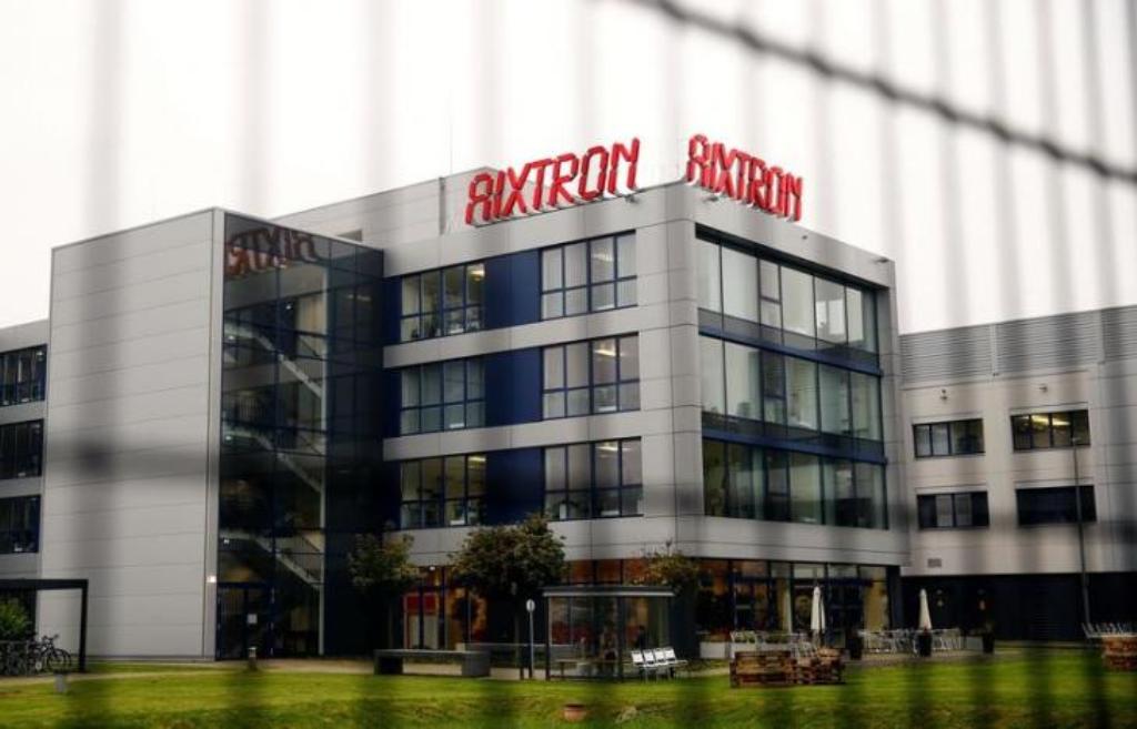 The headquarters of German chip equipment maker Aixtron SE is pictured through a security fence in Herzogenrath near the western German city of Aachen, October 25, 2016. REUTERS/Wolfgang Rattay.