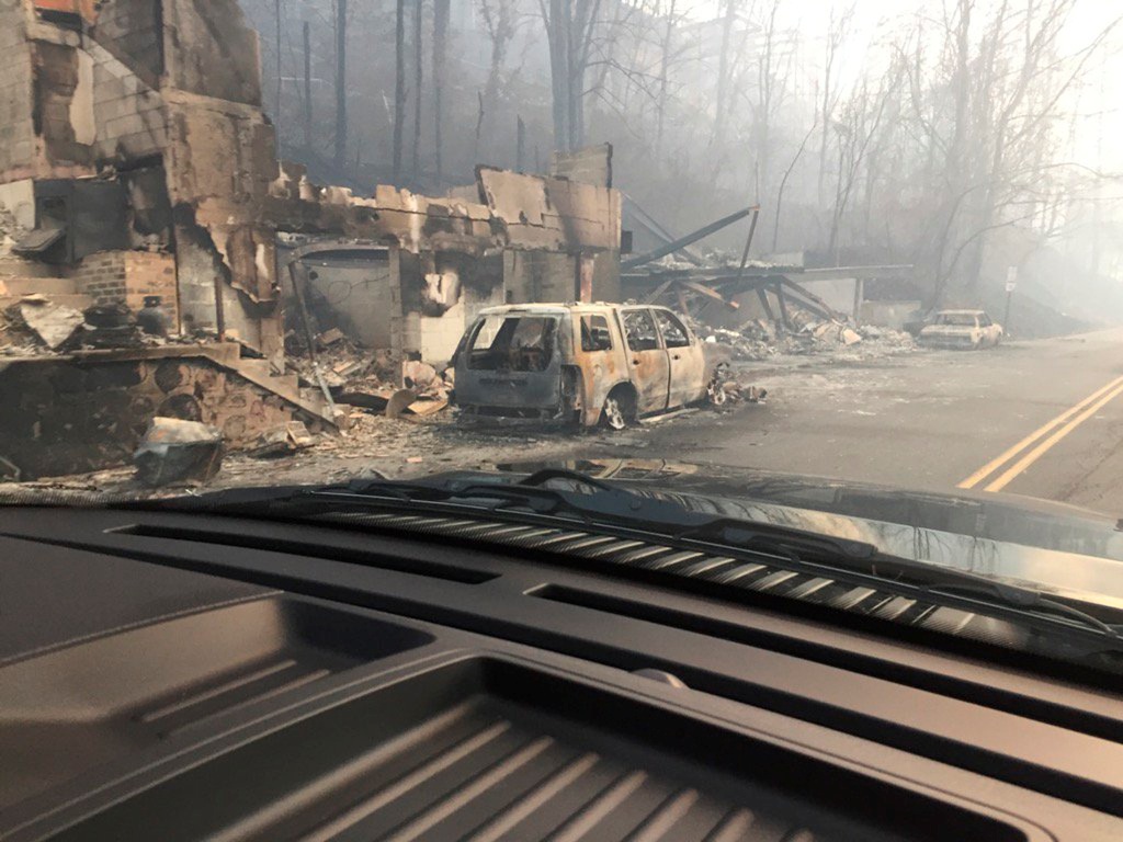 Burned buildings and cars aftermath of wildfire is seen in this image released in social media by Tennessee Highway Patrol in Gatlinburg, Tennessee, U.S. on November 29, 2016. / Reuters.