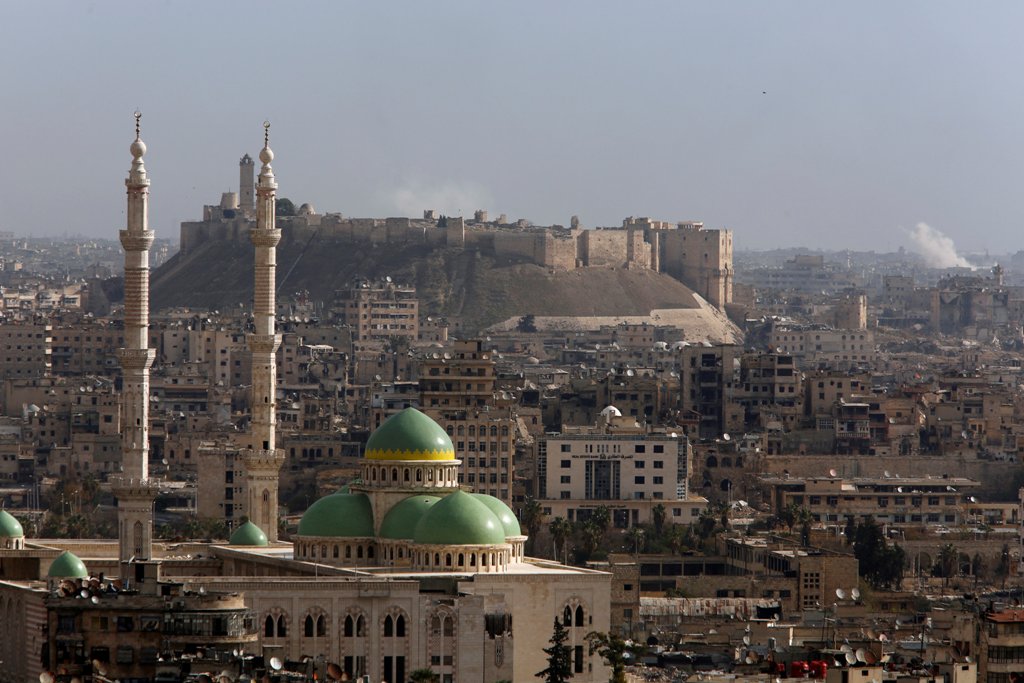 A general view shows rising smoke after strikes near Aleppo citadel in Aleppo city, Syria December 3, 2016. REUTERS/Omar Sanadiki 
