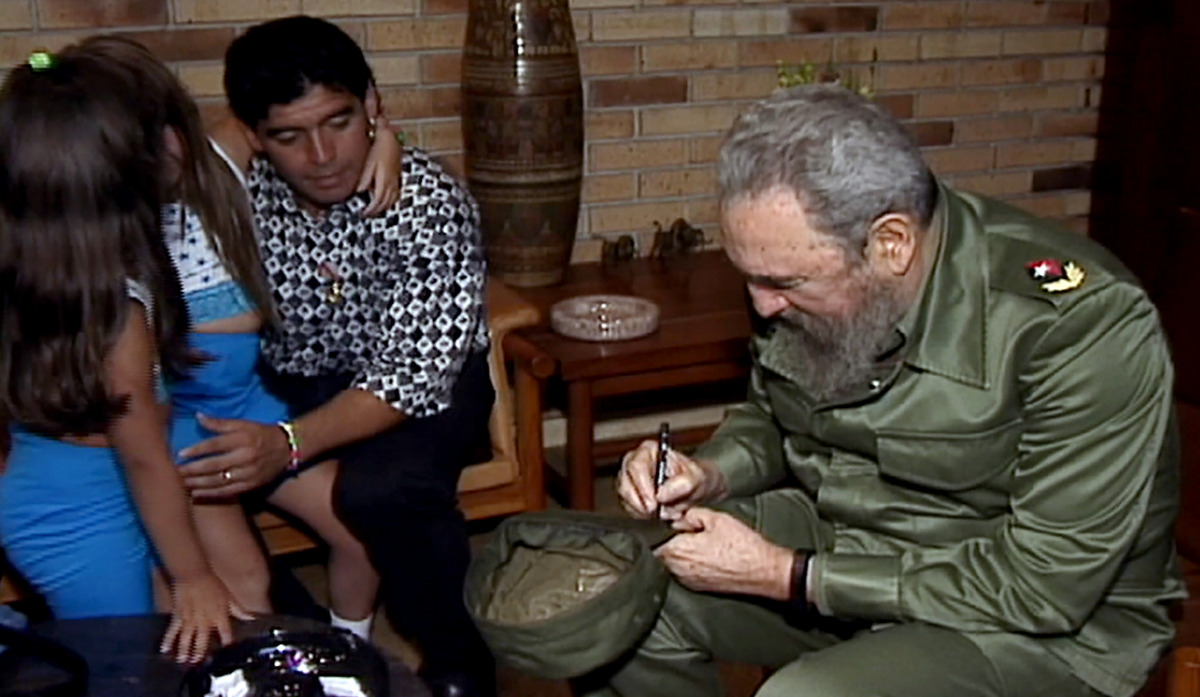 In this TV grab from a Cuban State Council video released December 2, 2016, the late Cuban leader Fidel Castro is seen with Argentine football legend Diego Armando Maradona and his daughters in Havana on December 29, 2002. The former president died on Nov