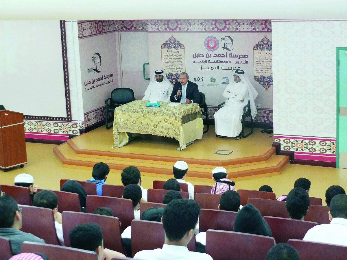 QIB officials during a visit to Ahmad bin Hanbal Independent Boys School recently.