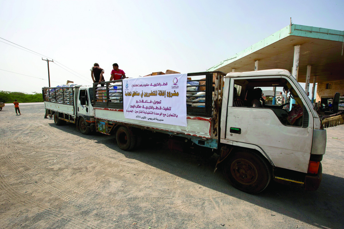 Volunteers in a Qatar Charity aid vehicle in Tihama city of war-torn Yemen.
