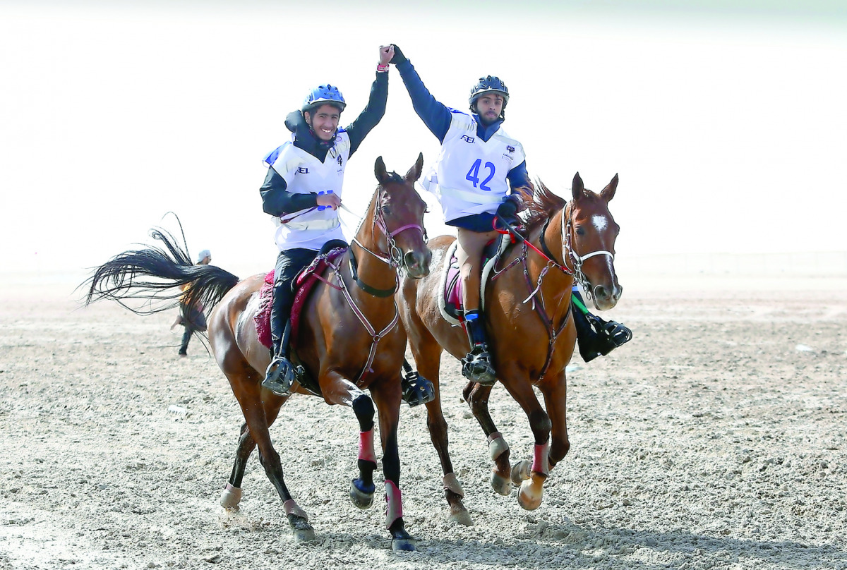 Saeed Hamad Saeed Juma (left) astride LP Hara, winning the 100km  CEIYJ* event of the National Day Endurance Ride, organised by the Qatar Endurance Committee at Endurance Village, Sealine, Mesaieed yesterday. 