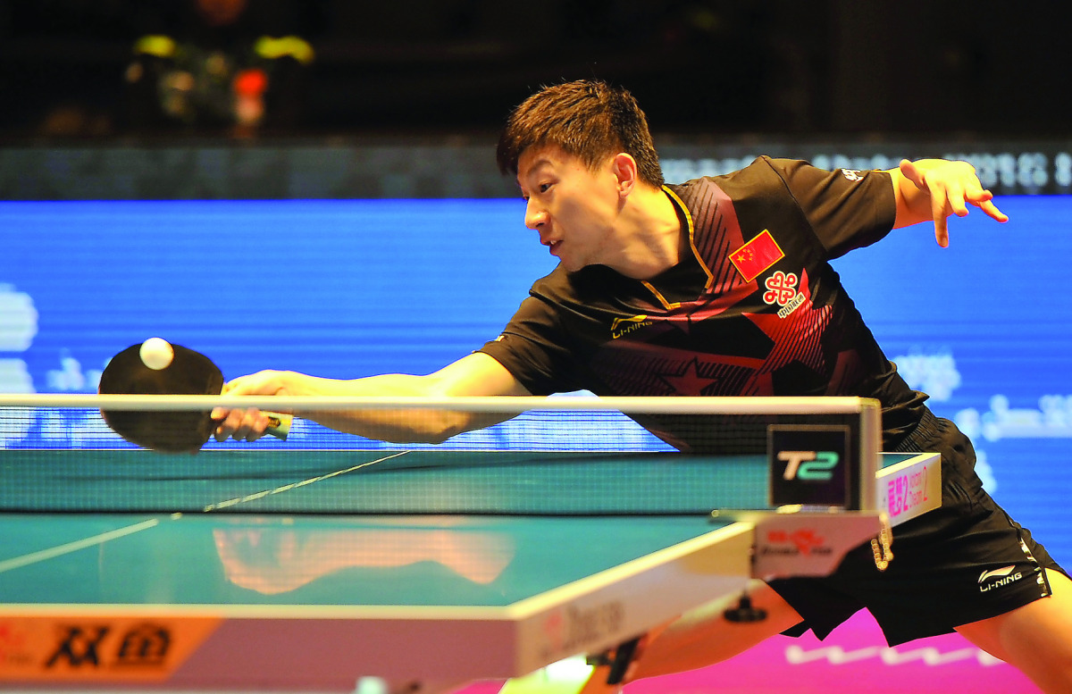 Ma Long of China in action against South Korea's Jeoung Youngsik during the ITTF World Tour Grand Finals at Ali Bin Hamad Al Attiyah Arena in Doha yesterday. Ma Long won 11-9, 11-8, 11-8, 14-12.
Pictures by: Abdul Basit / The Peninsula