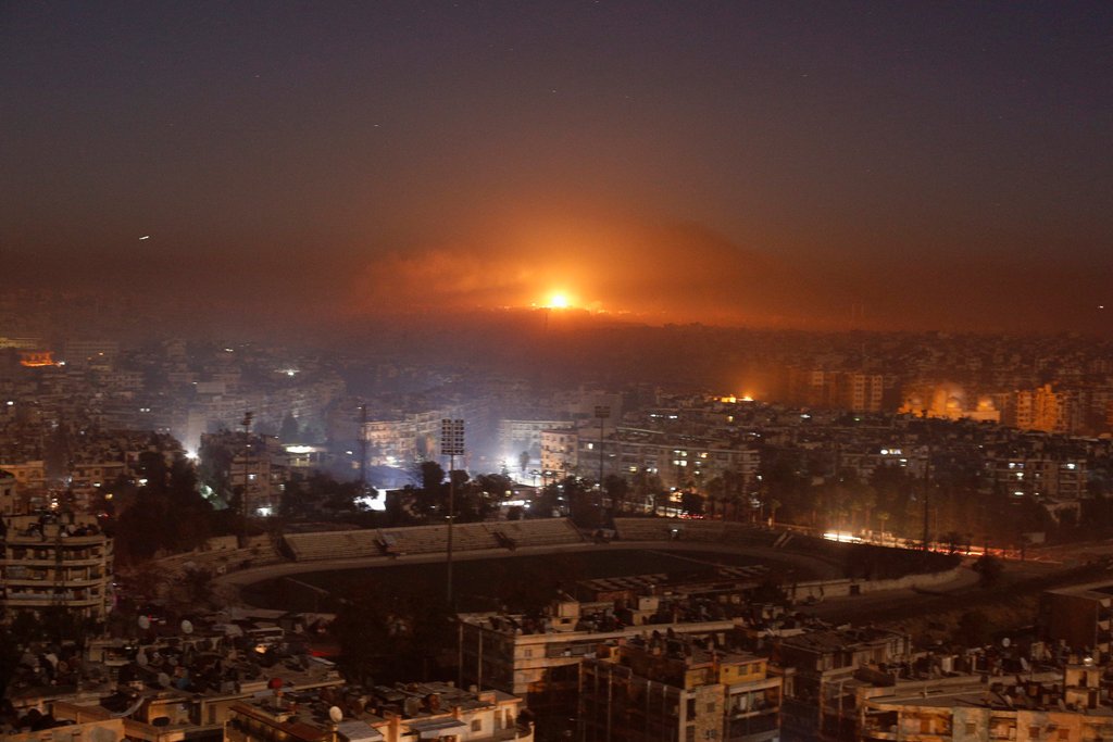 Smoke and flames rise after air strikes on rebel-controlled besieged area of Aleppo, as seen from a government-held side, in Syria December 11, 2016. REUTERS/Omar Sanadiki TPX IMAGES OF THE DAY.