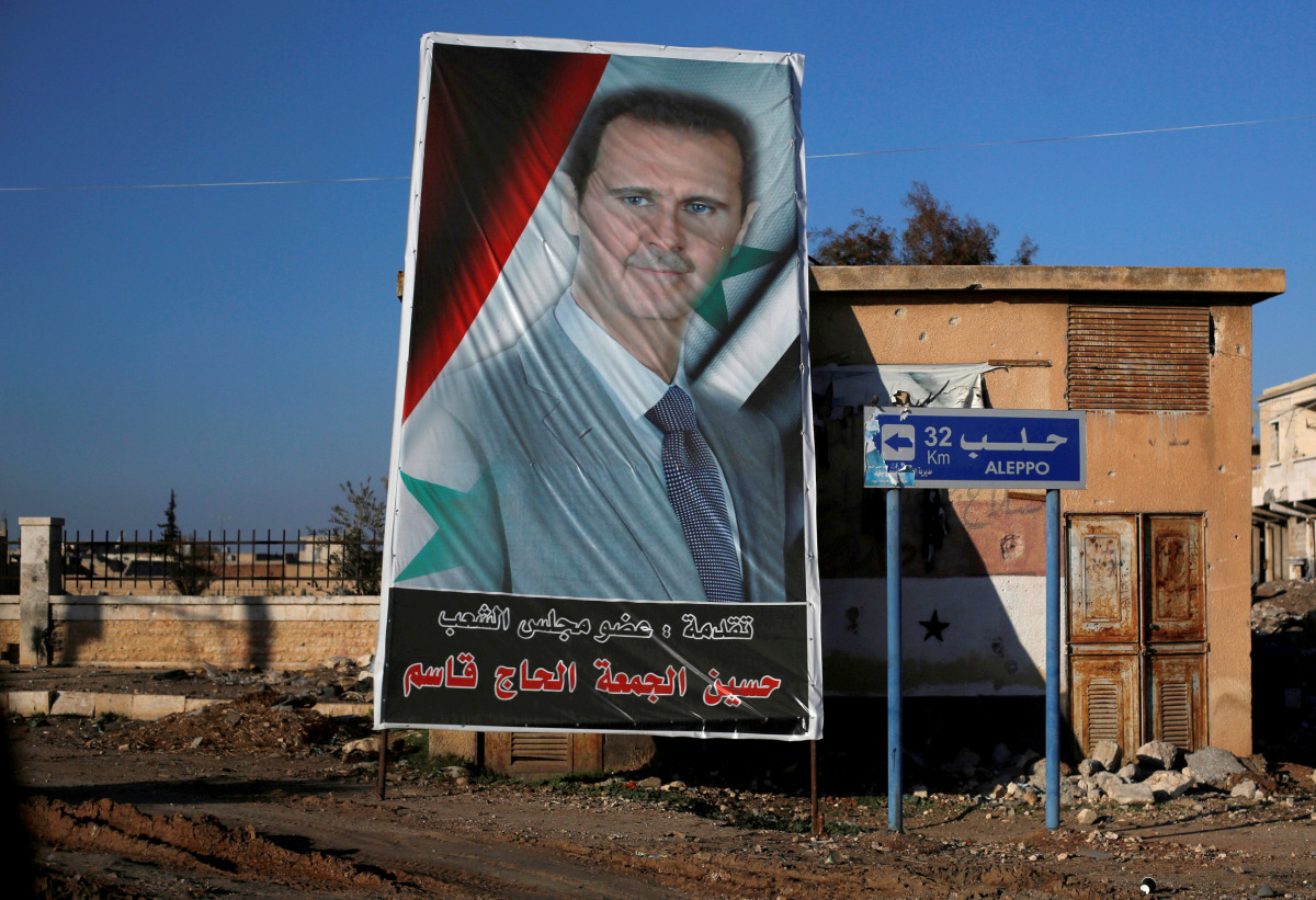 A picture of Syria's President Bashar al-Assad is seen in Ramouseh, a government controlled area of Aleppo, Syria December 8, 2016. REUTERS/Omar Sanadiki