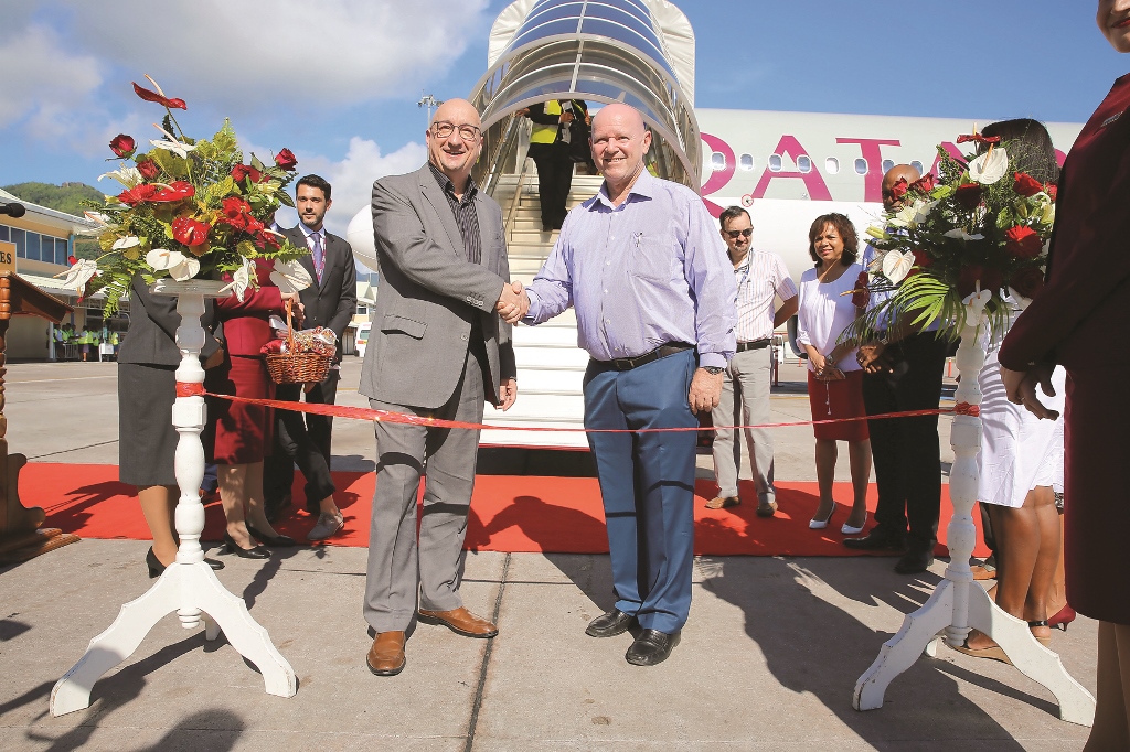 Qatar Airways Chief Commercial Officer, Dr Hugh Dunleavy (left), is welcomed by Seychelles Minister of Tourism, Civil Aviation, Ports and Marine, Alain St Ange, after the touchdown of the airline's inaugural flight to the Seychelles.