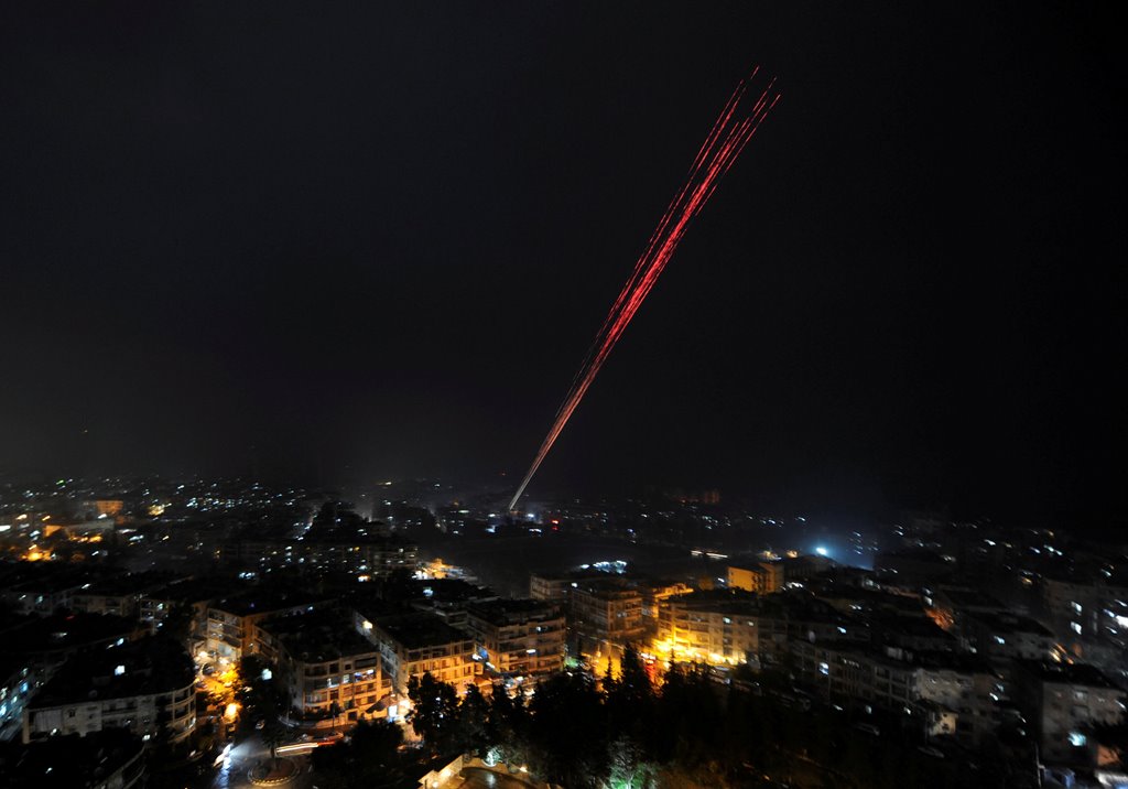 Govermental Syrian forces fire into sky as celebrating their victory against rebels in eastern Aleppo, Syria December 12,2016. REUTERS/ Omar Sanadiki 
