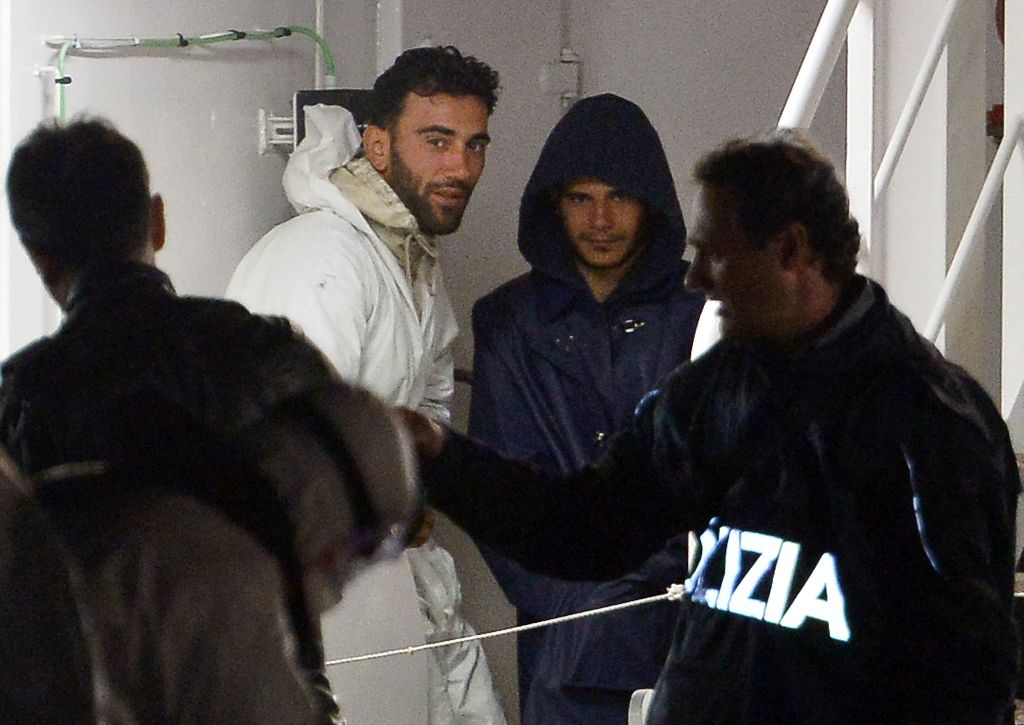 (FILES) This file photo taken on April 20, 2015 shows two men, identified as Mohammed Ali Malek (2nd L).  AFP / ALBERTO PIZZOLI
