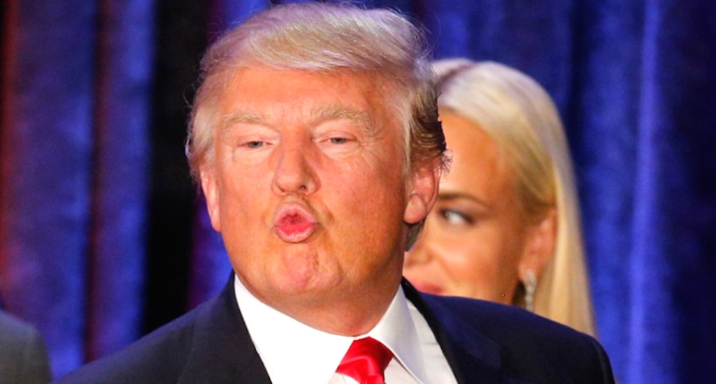 Donald Trump makes a face at his caucus night rally in Des Moines. REUTERS

