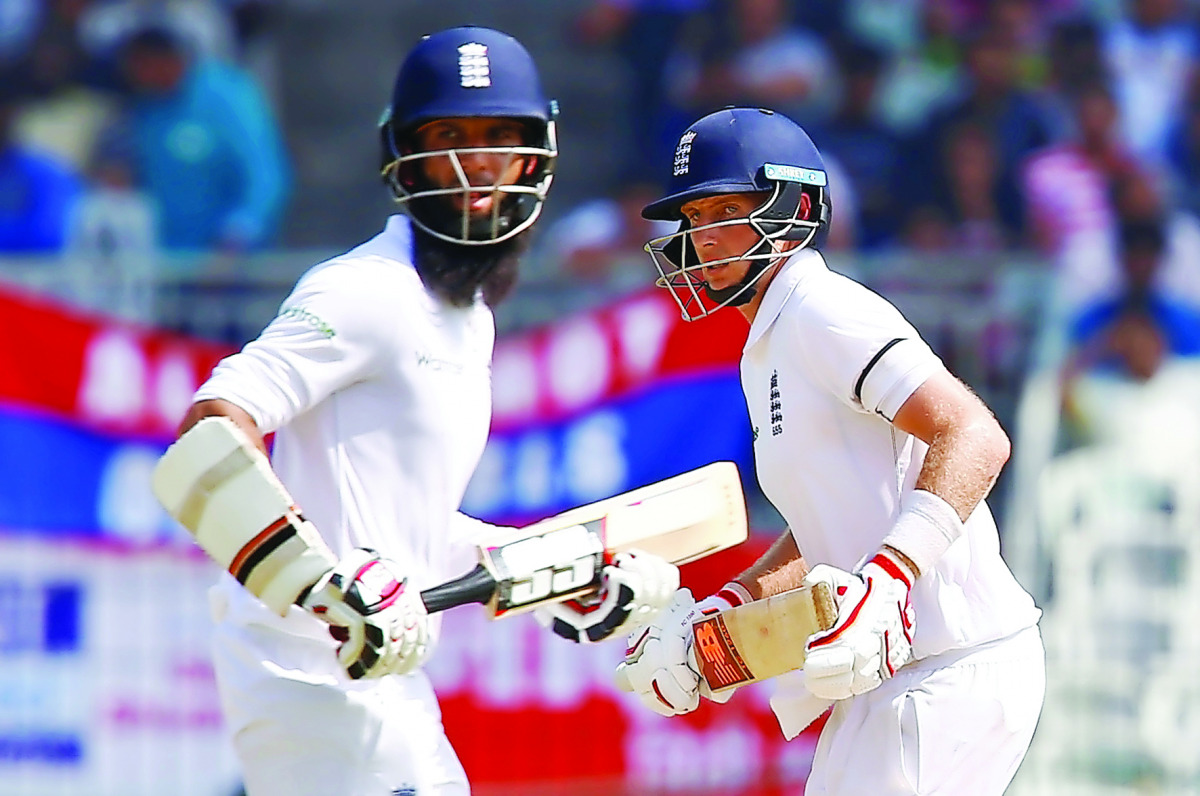England's Joe Root (right) and Moeen Ali run between wickets during the first day of the fifth Test match at the M A Chidambaram Stadium, Chennai, India, yesterday.