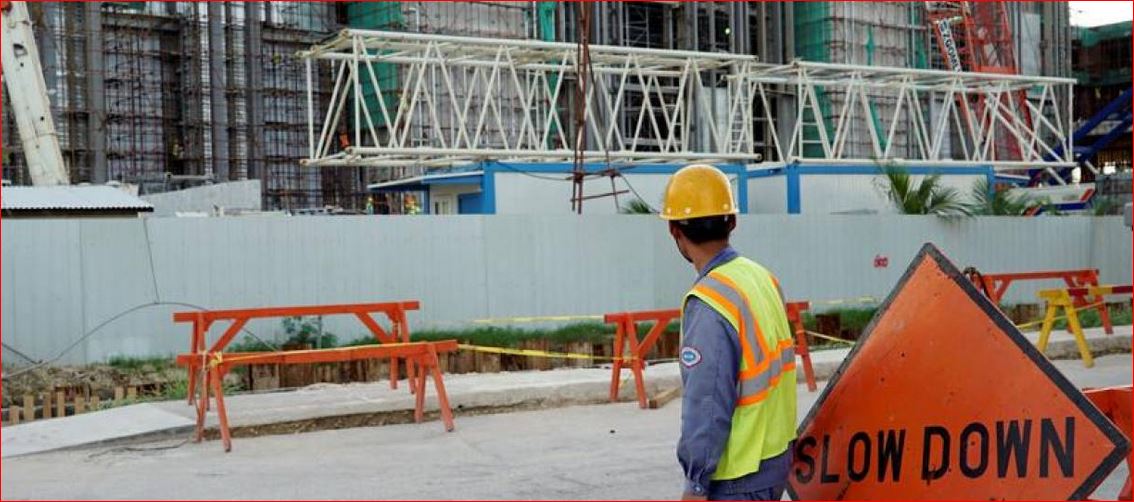 In this file photo, a worker stands outside the construction site of a new casino at Saipan, a U.S. South Pacific island, November 21, 2016. REUTERS/Natalie Thomas