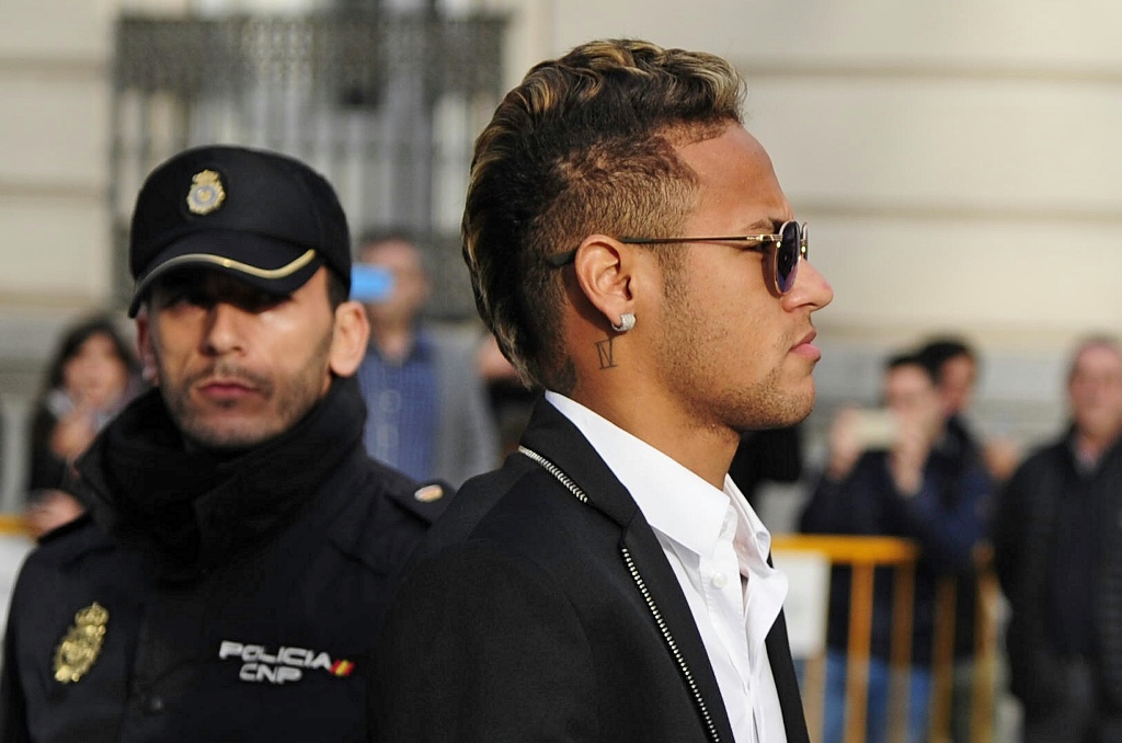 (FILES) This file photo taken on February 2, 2016 shows Barcelona's Brazilian forward Neymar arriving to Spain's national court in Madrid. AFP / CURTO DE LA TORRE