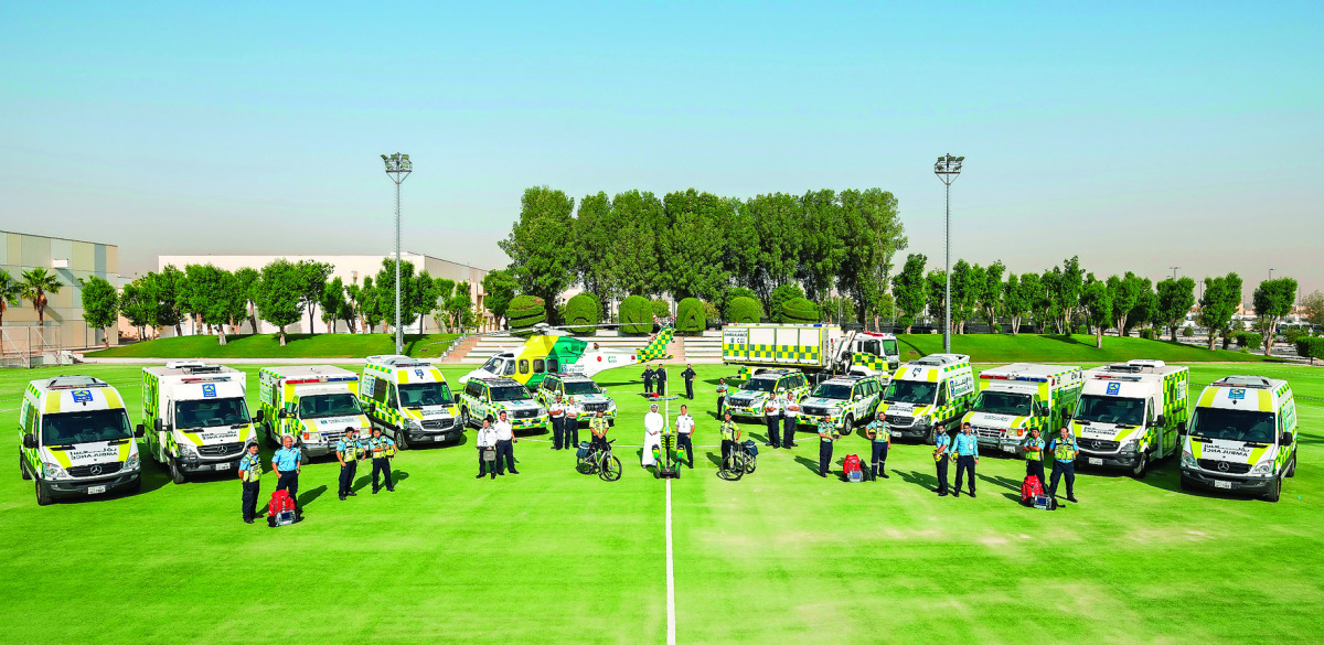 Hamad Medical Corporation’s (HMC) Ambulance Service employees with vehicles and equipment.
