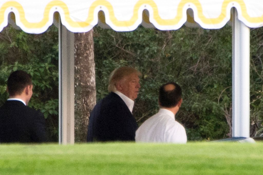 US President-elect Donald Trump is seen at his Mar-a-Lago estate in Palm Beach, Florida on December 19, 2016. / AFP / JIM WATSON
