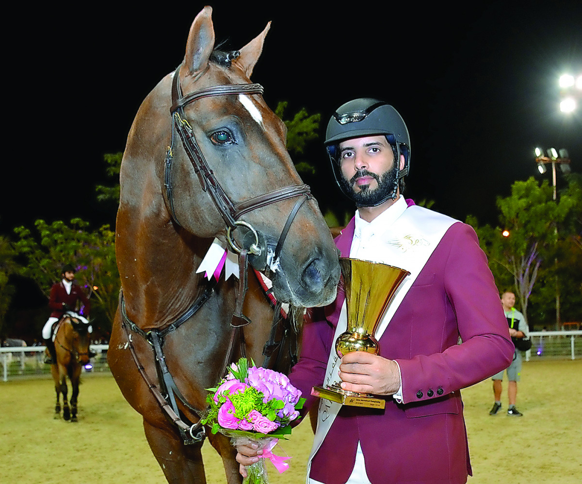 Mubarak Yousuf Al Rumaihi poses with his trophy