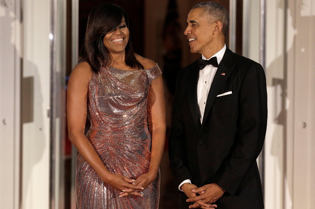 US President Barack Obama and US first lady Michelle Obama speak at their final state dinner. Reuters 
