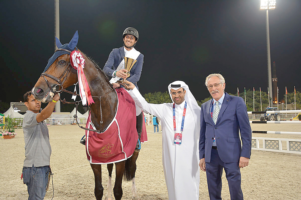 Victorious Ali Al Khorafi, astride  Cheril, receives his trophy.