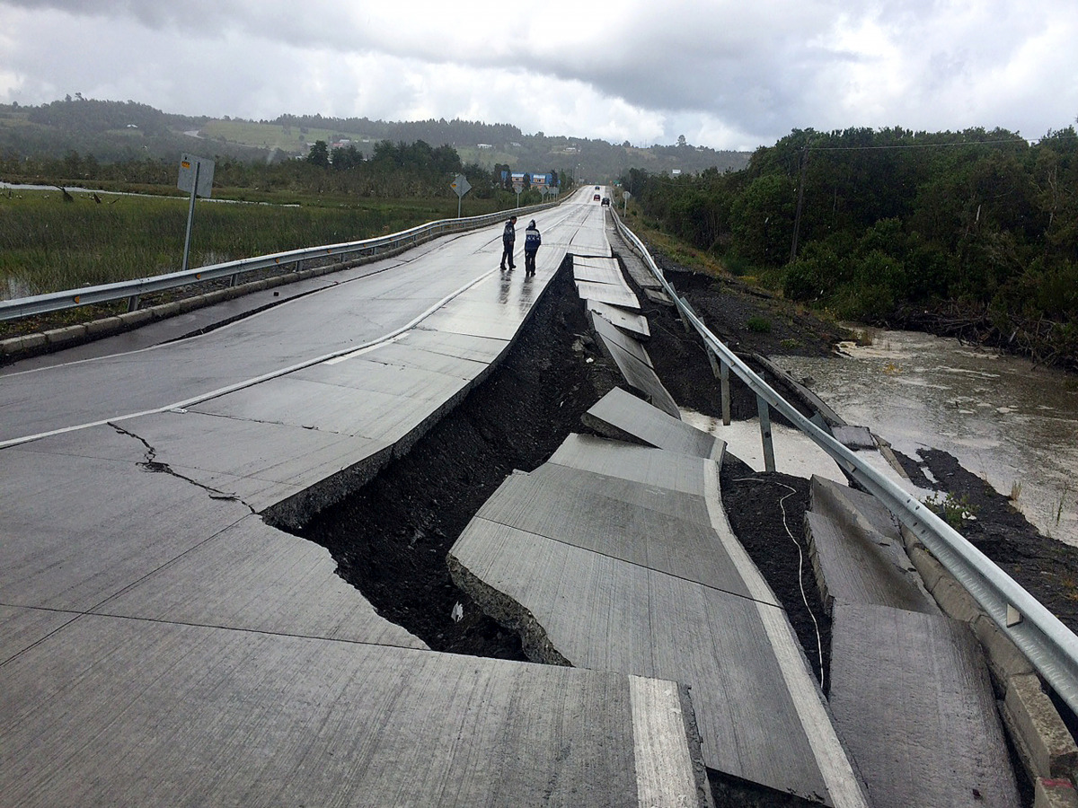 A damaged road is seen after a quake at Tarahuin, on Chiloe island, southern Chile, December 25, 2016. REUTERS/Alvaro Vidal 