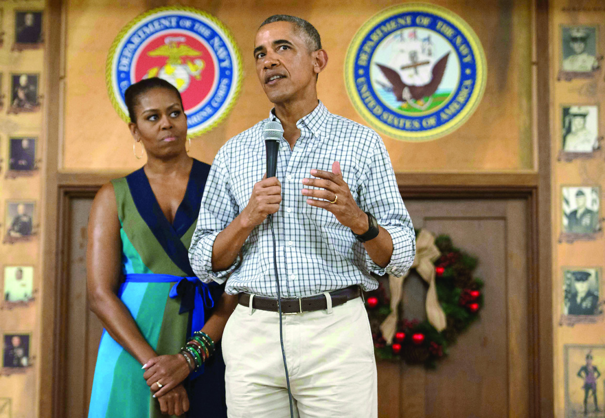 US President Barack Obama addresses troops with First Lady Michelle Obama at Marine Corps Base Hawaii in Kailua, yesterday.