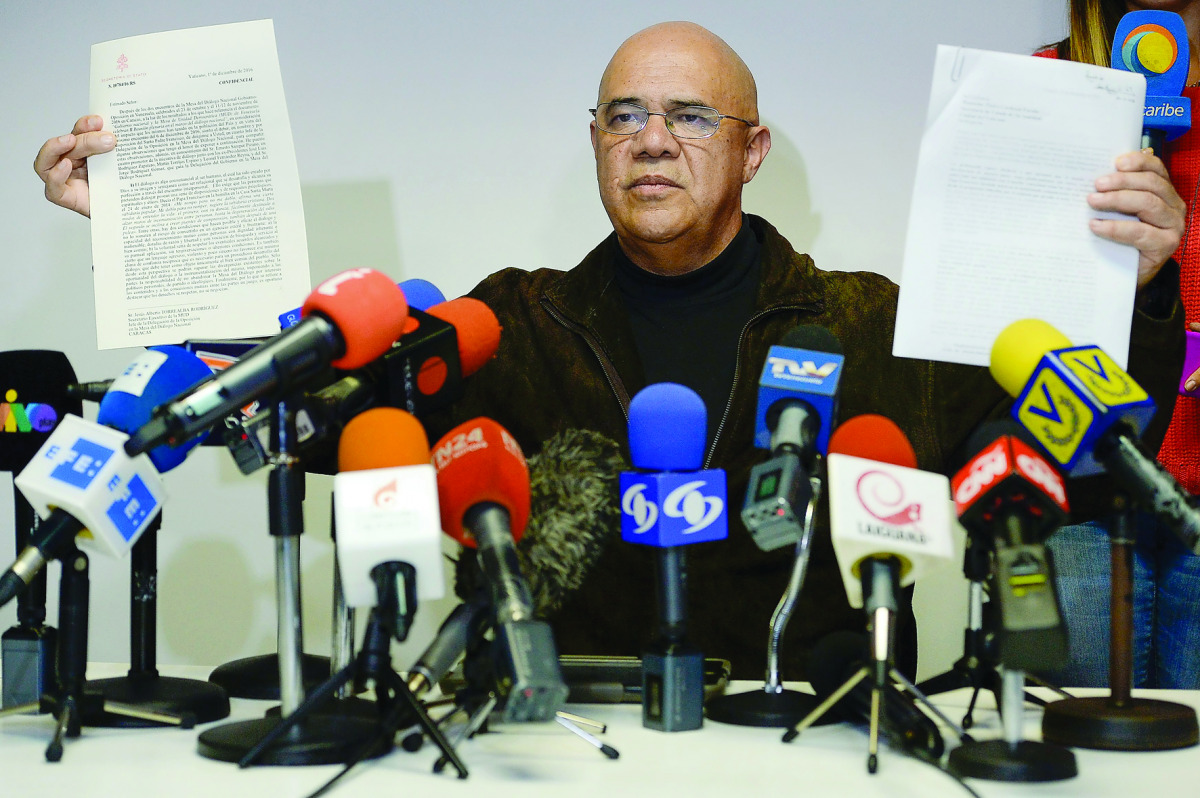 The secretary general of the Venezuelan opposition Democratic Unity Roundtable (MUD), Jesus Torrealba, shows a letter from the Vatican's Secretary of State, Italian cardinal Pietro Parolin, during a press conference in Caracas.