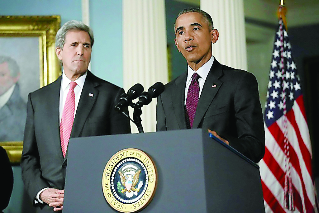 US President Barack Obama delivers a statement after meeting with the National Security Council, accompanied by US Secretary of State John Kerry (left) at the State Department in Washington, DC.