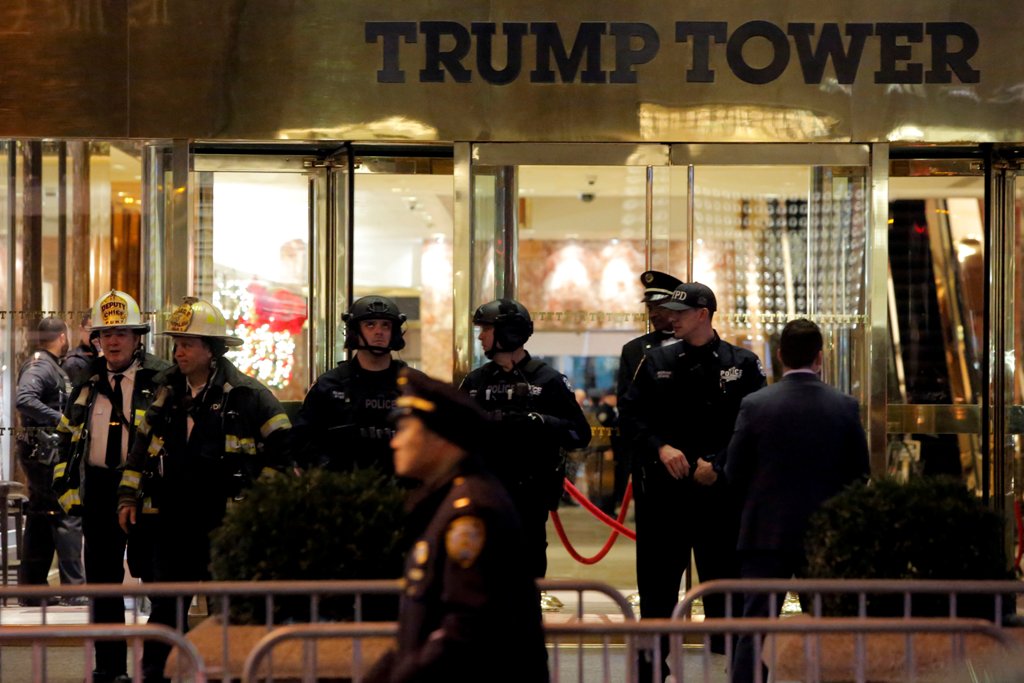 Police and fire crew stand outside Trump Tower following a report of a suspicious package in Manhattan, New York City, U.S., December 27, 2016. REUTERS/Andrew Kelly
