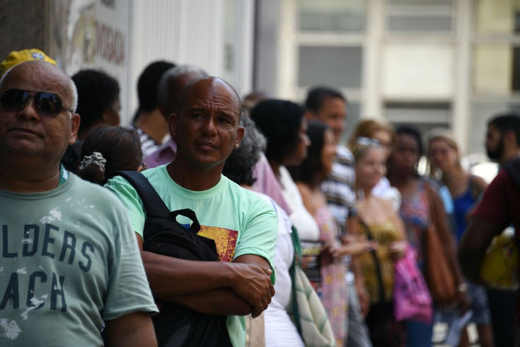 Public servants of Rio de Janeiro state queue outside their union building to receive food and other supplies donated by volunteers and colleagues as some of them haven't received their payment for several months, in Rio de Janeiro, Brazil on December 27,