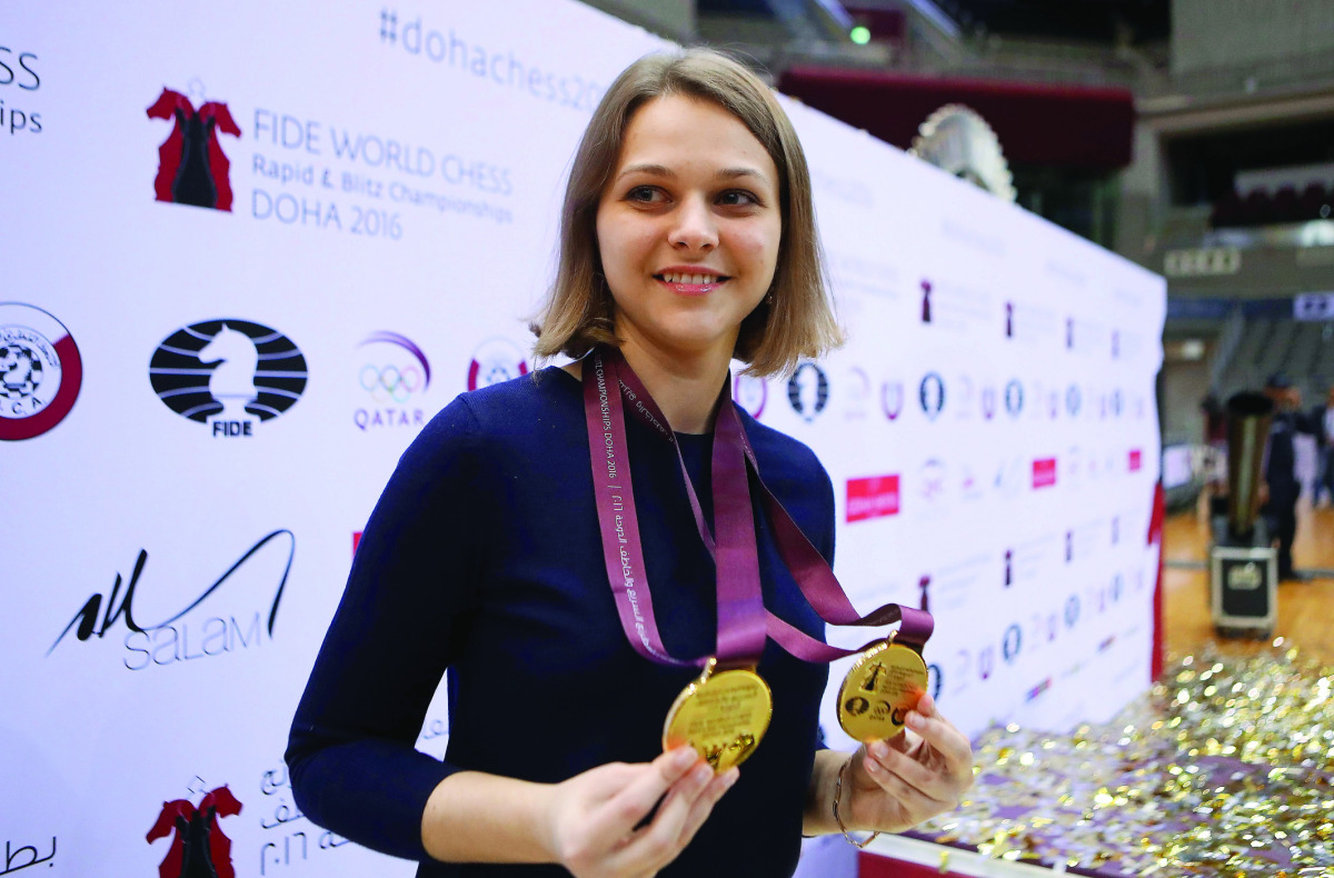 Ukraine's grandmaster Anna Muzychuk celebrates after winning both FIDE  World Chess Rapid and Blitz Championships, in Doha  yesterday.