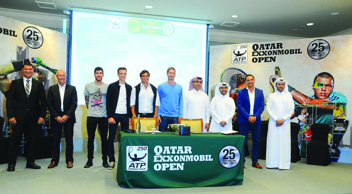 Players taking part in the Qatar ExxonMobil Open, pose for a picture with officials of Qatar Tennis Federation after the draw ceremony.  