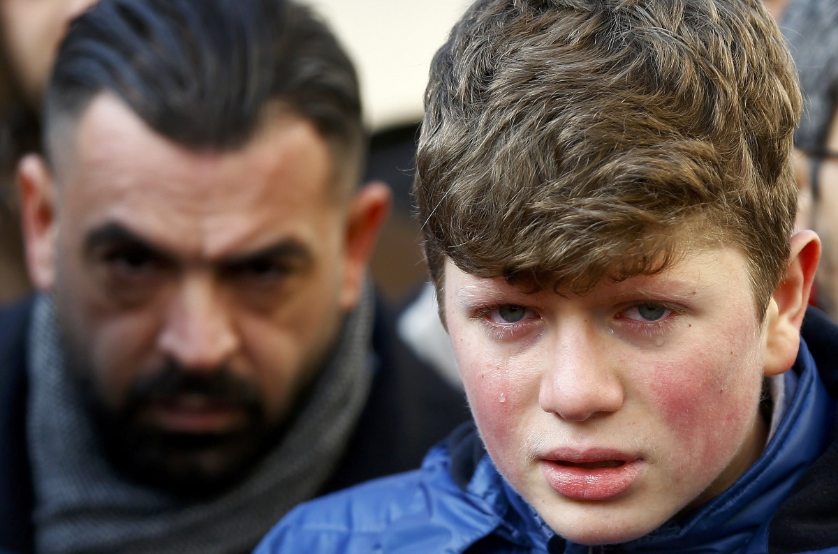 A boy cries at the funeral of Ayhan Arik, a victim of an attack by a gunman at Reina nightclub, in Istanbul, Turkey, January 1, 2017. REUTERS/Osman Orsal