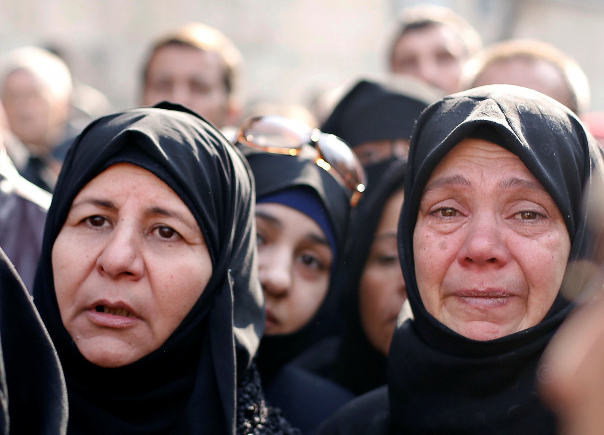 Women react outside a government military police centre to visit their relatives who were evacuated from the east Aleppo and are being prepared for military service in Aleppo, December 11, 2016 (REUTERS) 