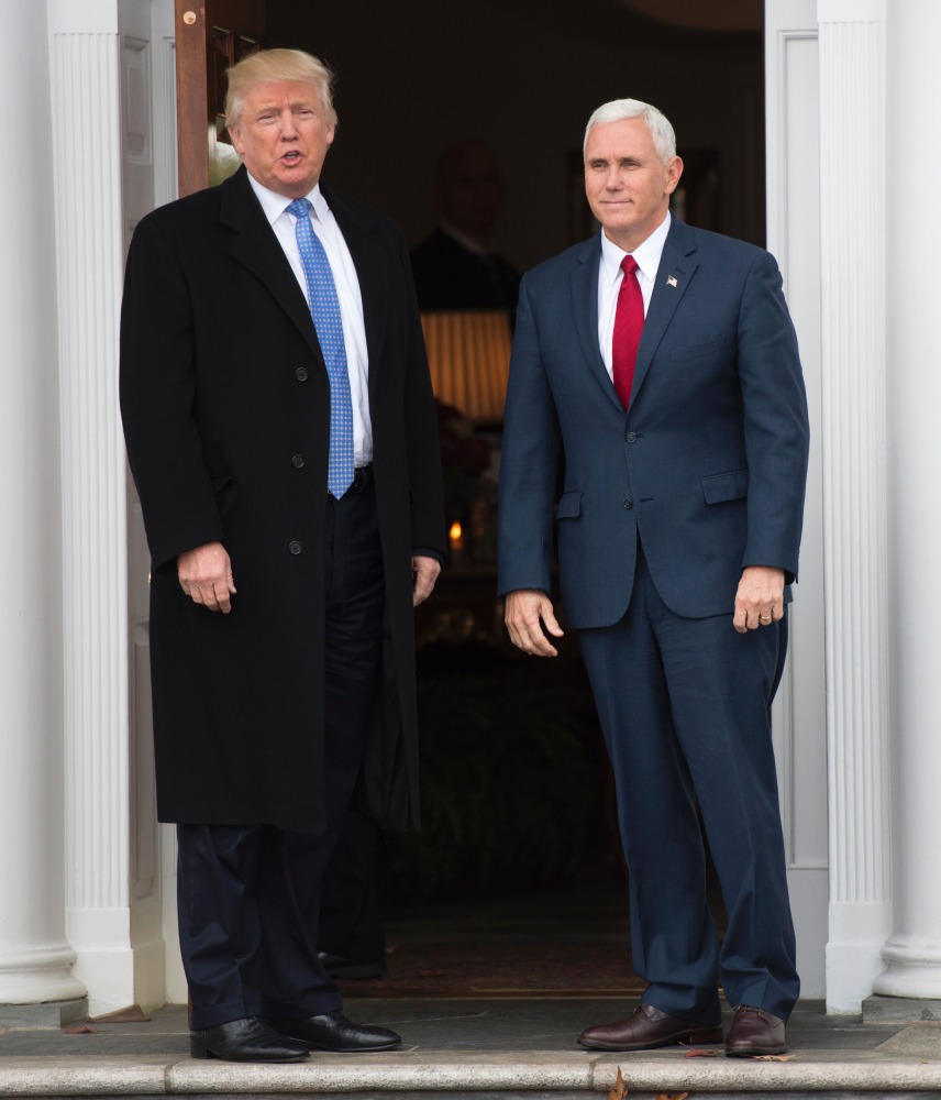 Donald Trump and Mike Pence arrive for a day of meetings at the clubhouse of Trump National Golf Club, November 20, 2016 in Bedminster, NJ (AFP / DON EMMERT) 