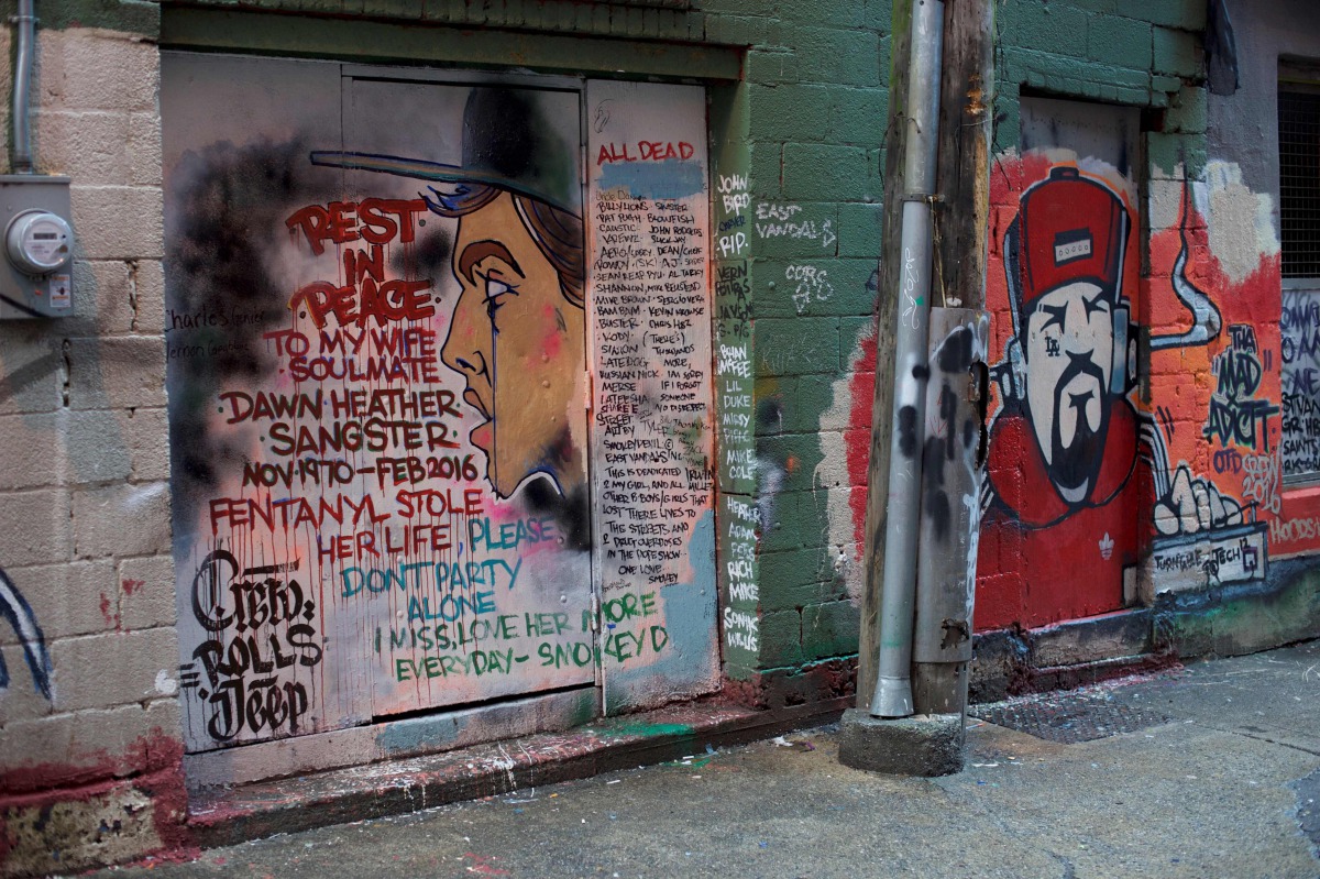 A mural in an alley in Vancouver's Downtown Eastside, on December 21, 2016, painted by a man mourning the fentanyl overdose death of his wife, with names of other victims of the crisis that killed 128 people in British Columbia in November. AFP / Deborah 