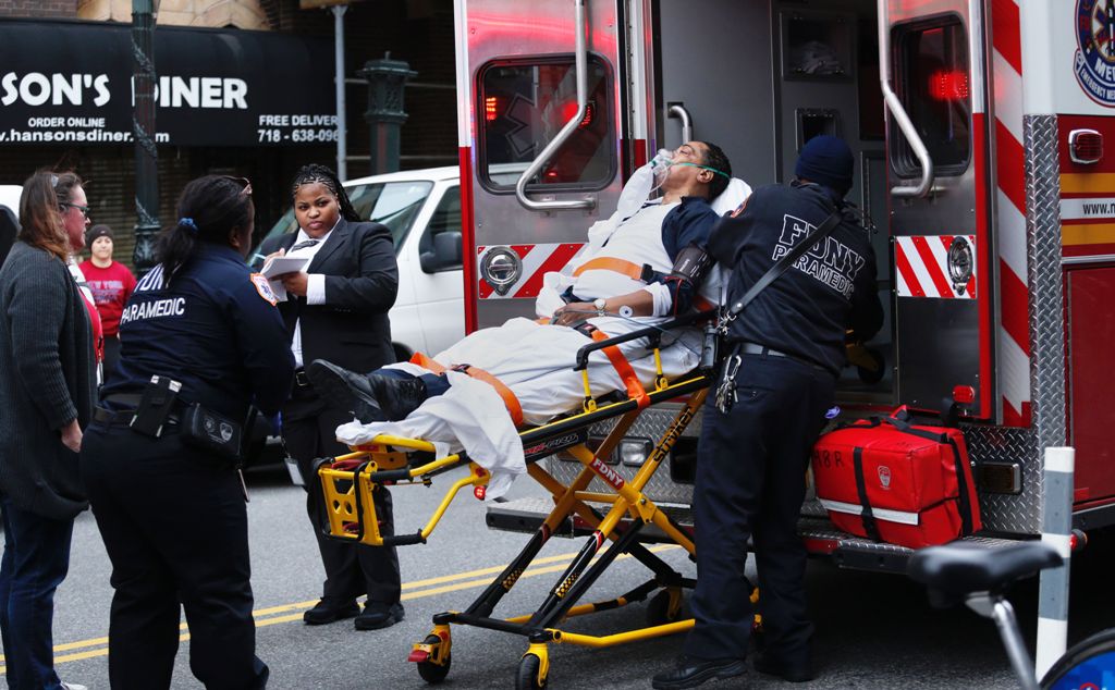 A commuter train derailed Wednesday at a station in Brooklyn and injured nearly 80 people, officials said, setting off a panic during the morning rush.  AFP / Kena Betancur
