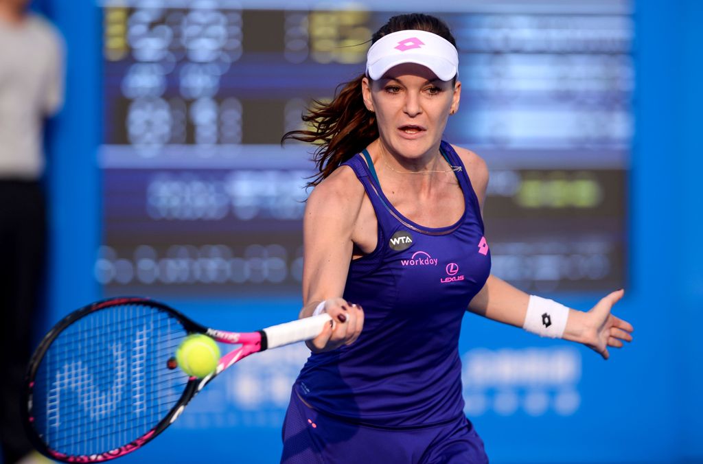 Agnieszka Radwanska of Poland hits a return against Sorana Cirstea of Romania during their match at the WTA Shenzhen Open in Shenzhen, in China's southern Guangdong province on January 3, 2017. / AFP / STR
