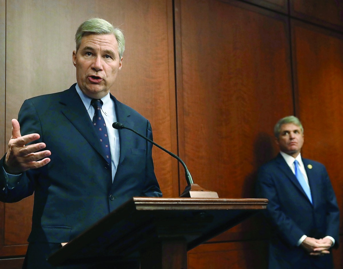 Senator Sheldon Whitehouse (left) and House Homeland Security Chairman Michael McCaul, speak about cybersecurity during news conference on Capitol Hill, in Washington, DC, yesterday.