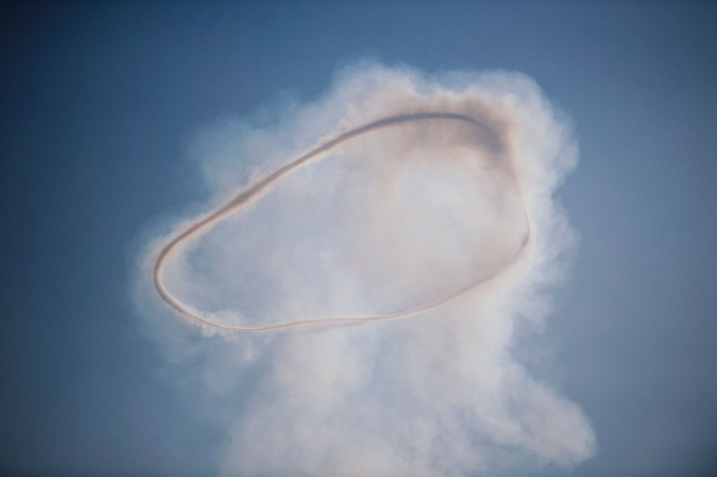 A picture taken on January 8, 2017 shows a mushroom cloud in the sky after a car bomb exploded in eastern Mosul, during an ongoing military operation against Islamic State (IS) group militants.  AFP / Dimitar DILKOFF
