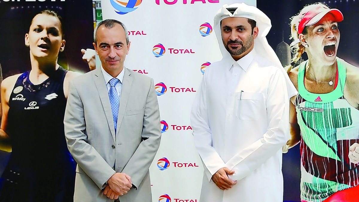 Guillaume Chalmin, Total E&P Qatar Managing Director (left) and Saad Al Mohannadi, Qatar Total Open Tournament Director pose for a photo during the launch of ticket-sales for 2017 Qatar Total Open.   