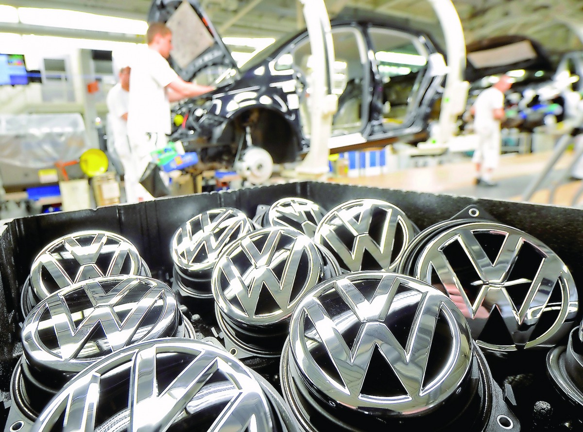 Emblems of VW Golf VII car are pictured in a production line at the plant of German carmaker Volkswagen in Wolfsburg.