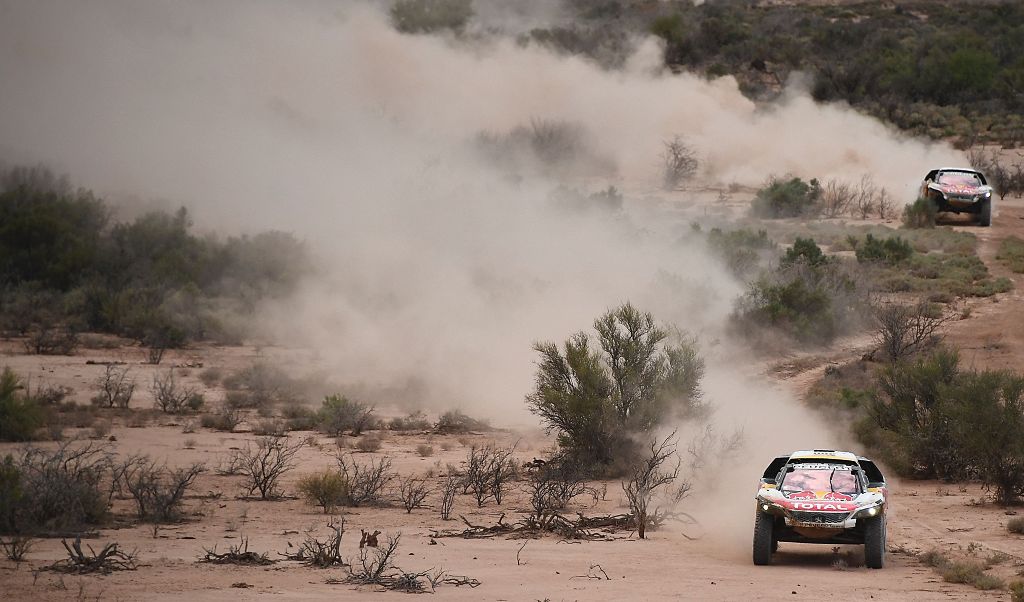 Peugeot's driver Stephane Peterhansel and his co-driver Jean Paul Cottret of France ride ahead of Peugeot's French driver Sebastien Loeb and co-driver Daniel Elena from Monaco during Stage 11 of the 2017 Dakar Rally between San Juan and Rio Cuarto, in Arg