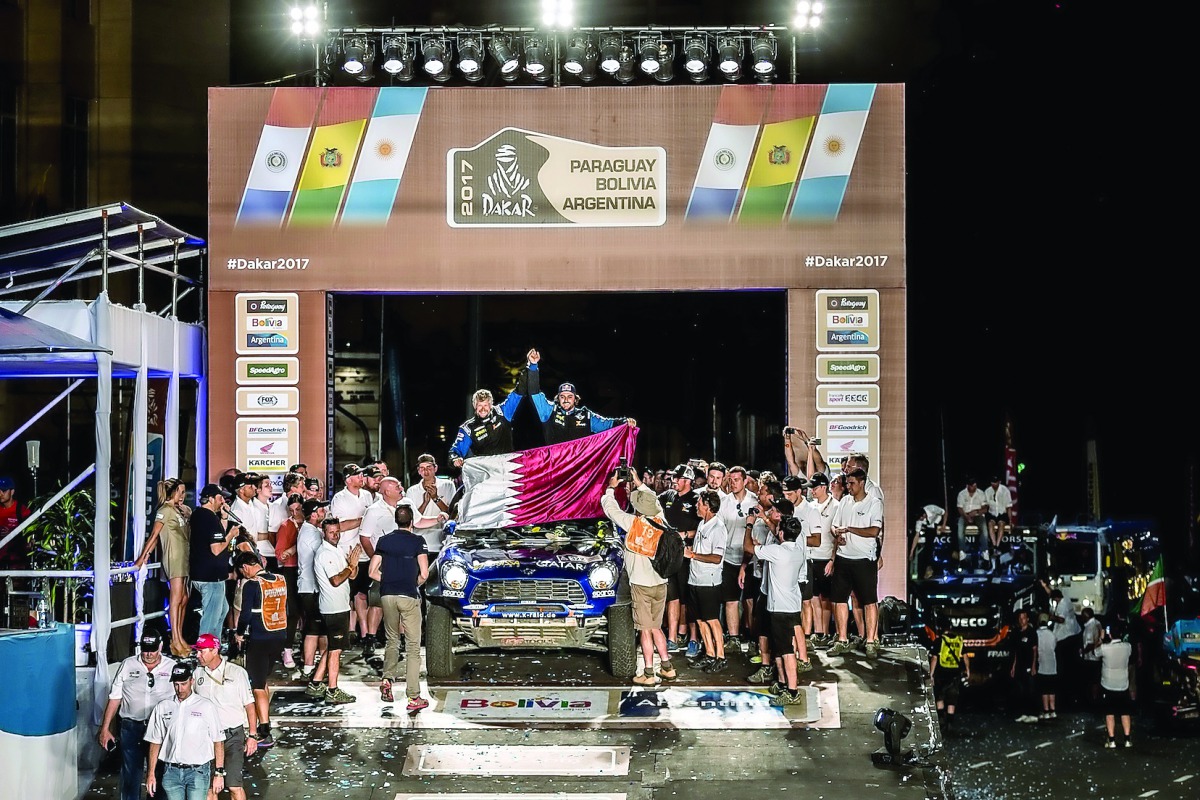 Qatari rally driver Mohammed Abu Issa (right) and his co-driver Xavier Panseri celebrate during the presentation ceremony after finishing 10th overall in the 2017 Rally Dakar in Buenos Aires, Argentina on Saturday.