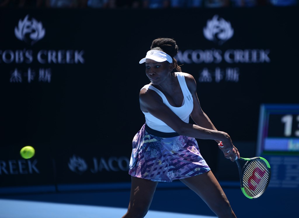 Venus Williams of USA returns the ball to Kateryna Kozlova (not seen) of Ukraine during their women's singles first round match on day one of the Australian Open tennis tournament in Melbourne, Australia on January 16, 2017. Recep ?akar - Anadolu Agency
