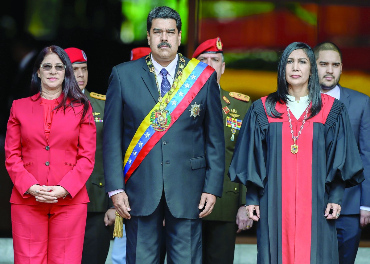 Venezuelan President Nicolas Maduro (centre), his wife Cilia Flores (left) and President of Supreme Court of Justice, Gladys Maria Gutierrez after the ceremony in Caracas.