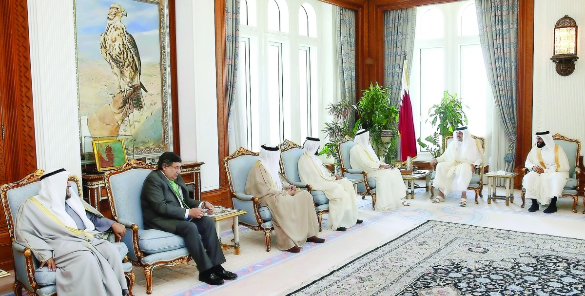 Emir H H Sheikh Tamim bin Hamad Al Thani with Organization of Islamic Cooperation Humanitarian Fund's (OICHF) delegation at Emiri Diwan, yesterday.