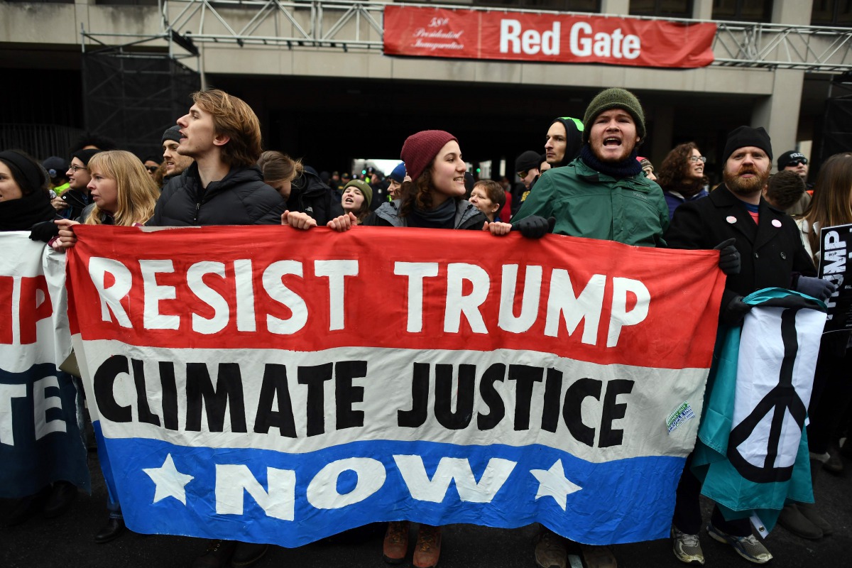 Demonstrators shout slogans against US President-elect Donald Trump in Washington, DC, on January 20, 2107. Donald Trump will be sworn in as the 45th president of the United States Friday -- capping his improbable journey to the White House and beginning 
