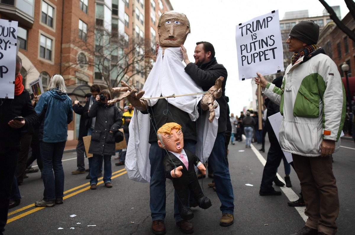Demonstrators protest against US President-elect Donald Trump in Washington, DC, on January 20, 2107.  Donald Trump will be sworn in as the 45th president of the United States Friday -- capping his improbable journey to the White House and beginning a fou