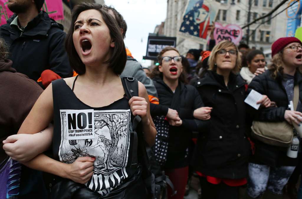 Anti-Trump protesters chant during a demonstration on January 20, 2017 in Washington, DC. Mario Tama/AFP
